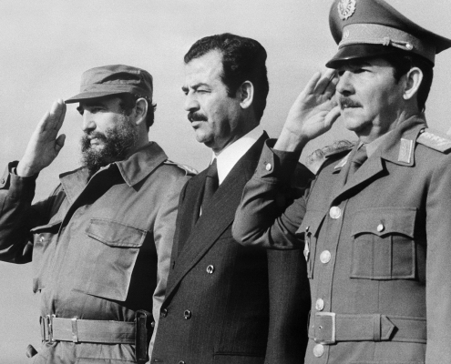 (FILES) This handout photo taken and released by Prensa Latina on January 30, 1979 in Havana, shows Iraqi vice-president Saddam Hussein (C) standing during his visit to Cuba with Cuban President Fidel Castro (L) and Defense minister General Raul Castro.
Cuban revolutionary icon Fidel Castro died late on November 25, 2016 in Havana, his brother announced on national television. / AFP PHOTO / PRENSA LATINA / -